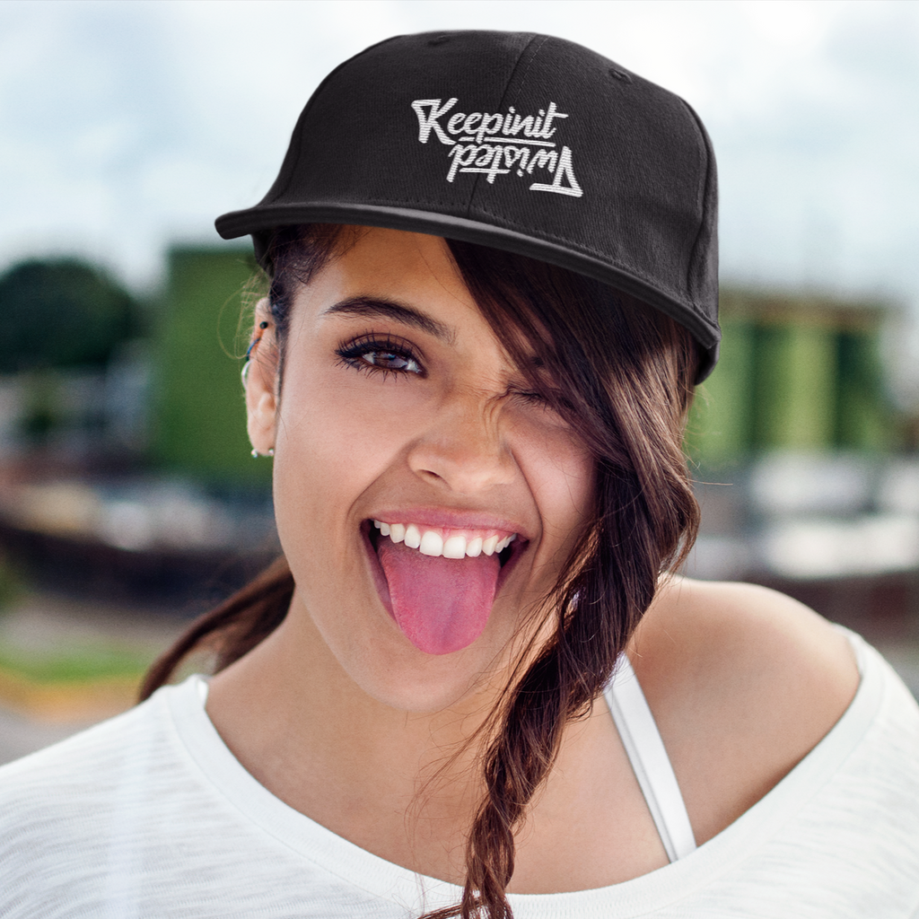 Woman wearing black snapback hat w/ KeepinItTwisted wordmark design